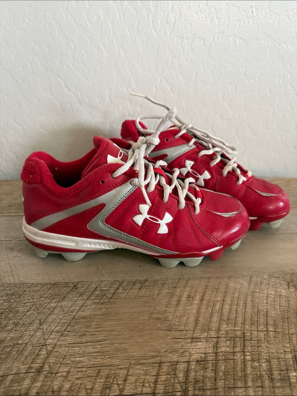 Under Armour Red and Silver Kids Cleats sz 4
